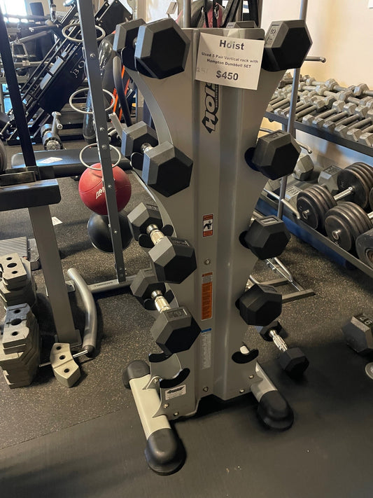 Used Hoist vertical stand loaded with Hampton urethane hex dumbbells