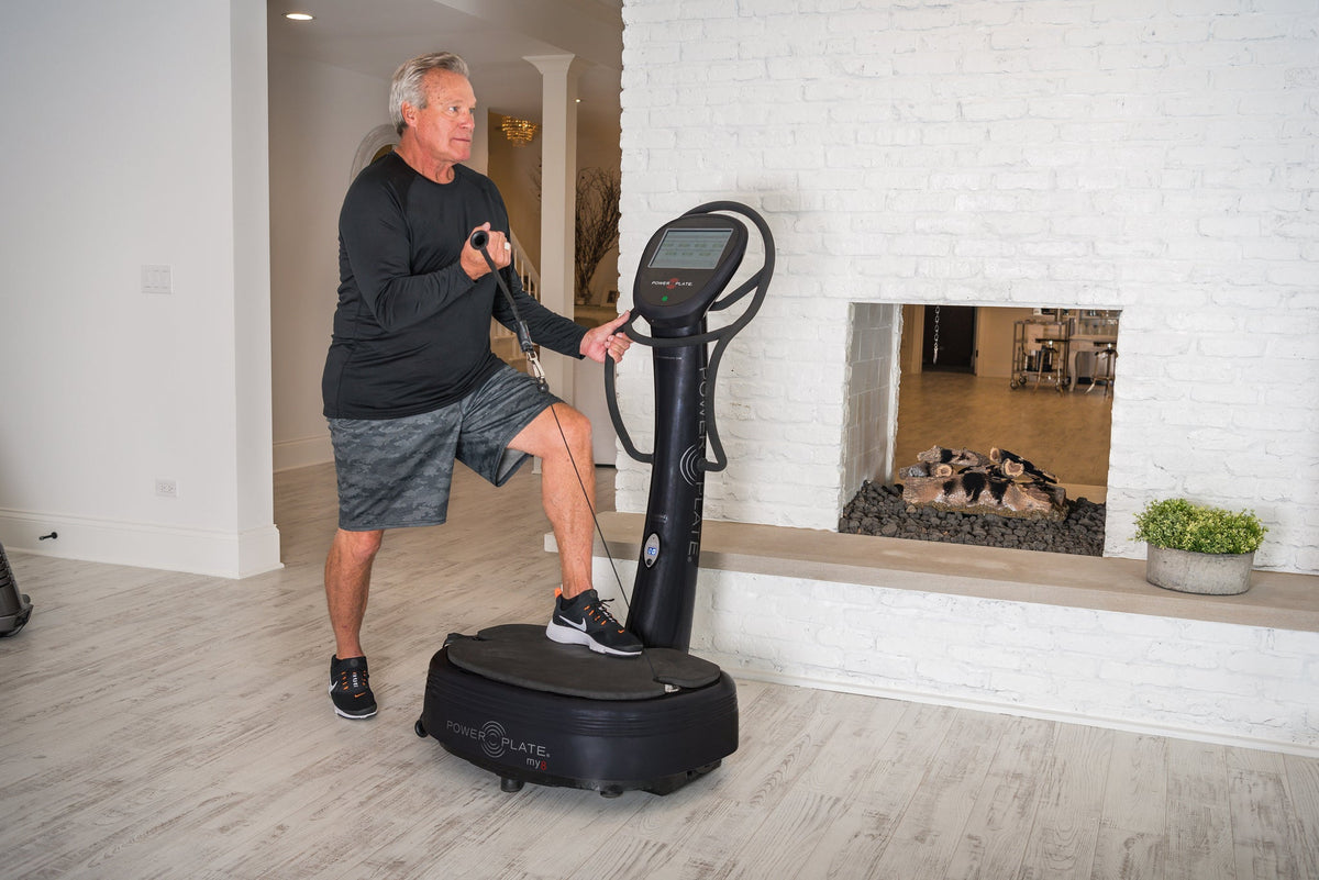 Man doing a step-up while pulling a proMOTION cable on a Power Plate my8