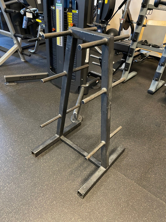 Used black steel plate tree with angled pegs and bar holders on a gym floor